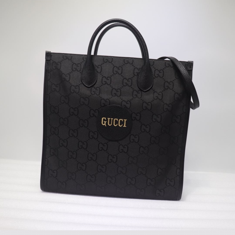 G*u*i shopping bags